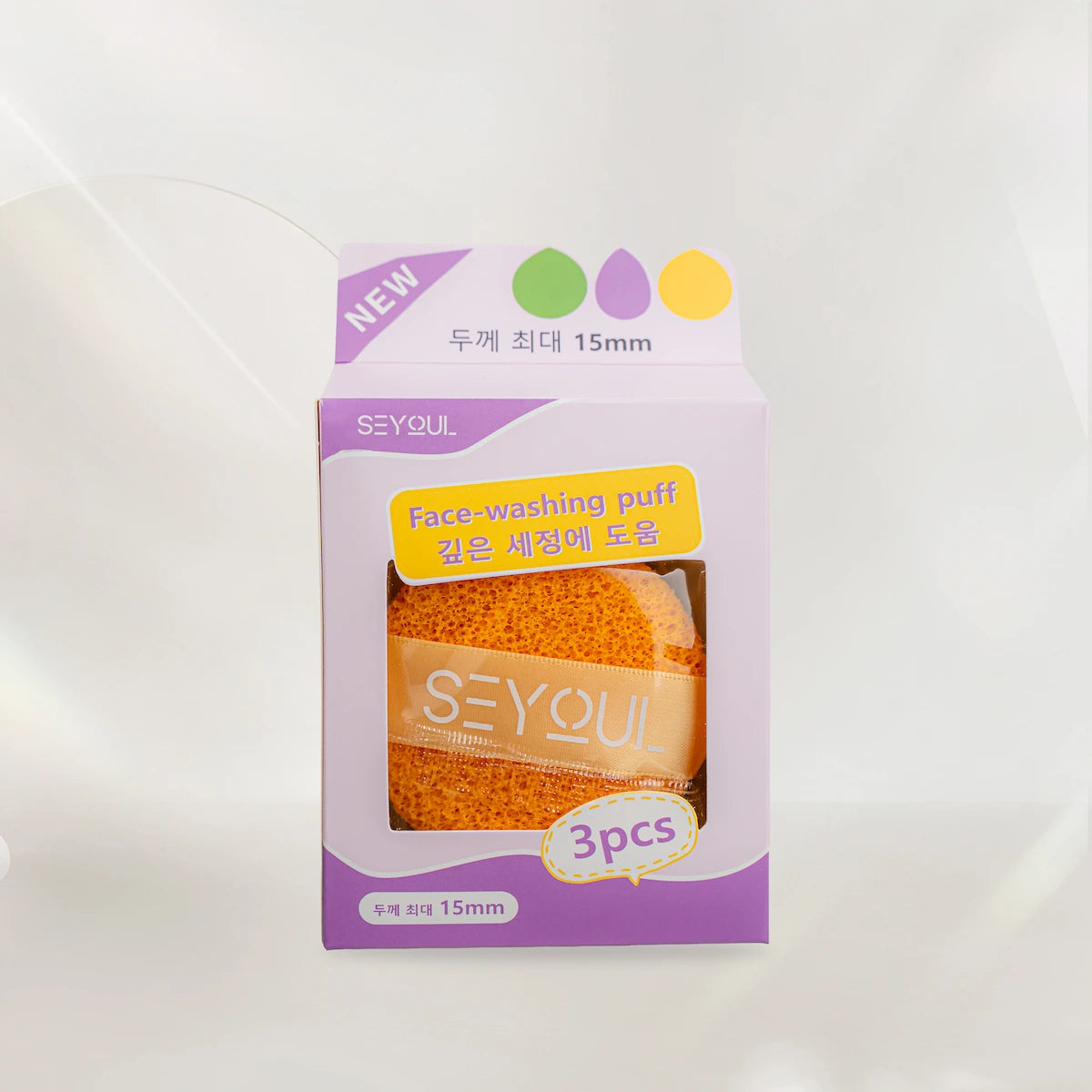 Face-washing puff 3-pack in purple and yellow box, visible orange cleansing sponges.